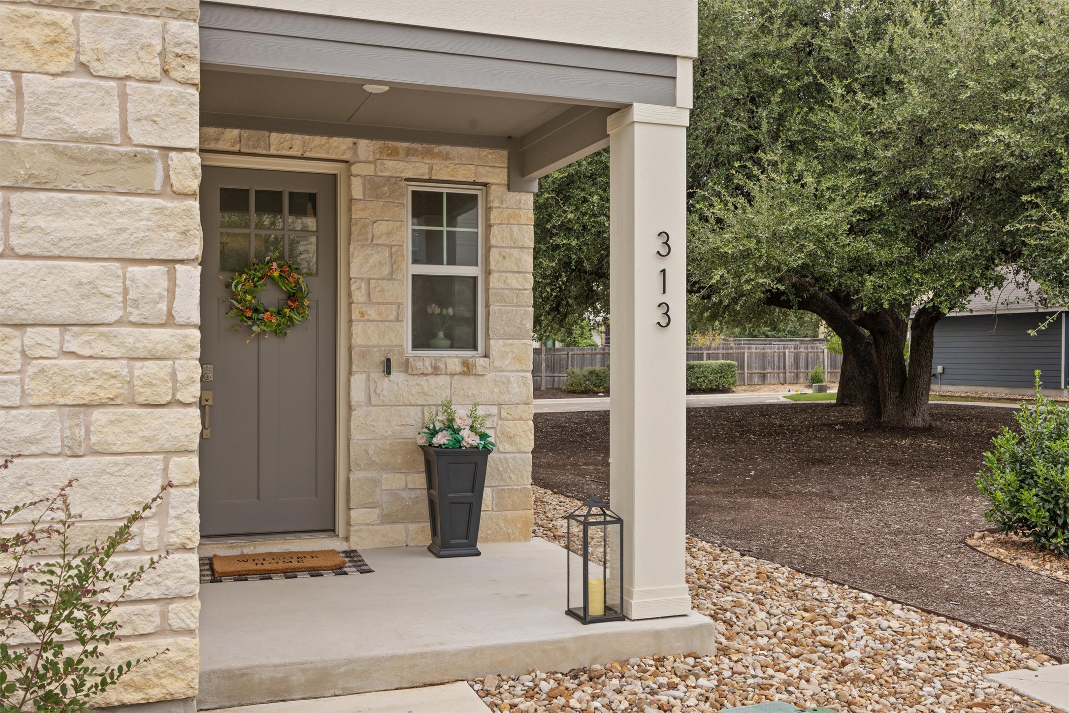 313 Toddy Way Leander, TX 78641 - Photo 2 of 39 Entrance to property with stone siding and a porch