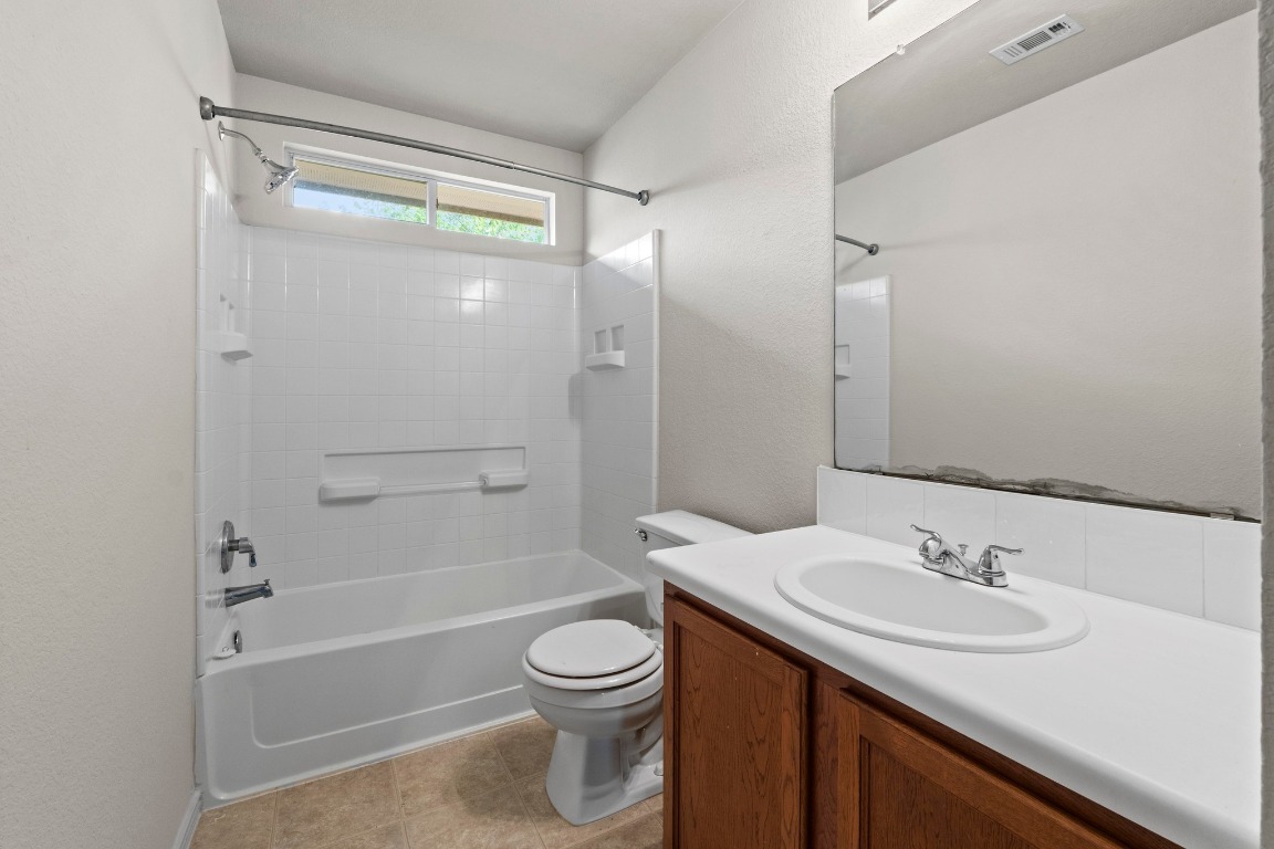 4608 Acers Lane Austin, TX 78725 - Photo 22 of 27 This full bathroom includes tile flooring and a bathtub/shower combo.