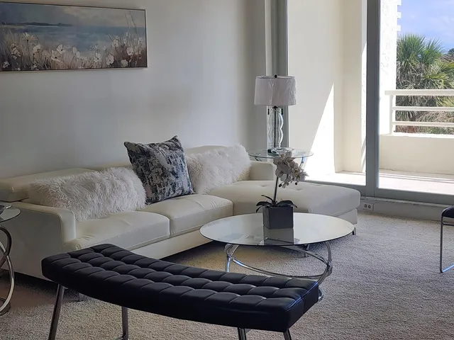 a view of a dining room with furniture and window