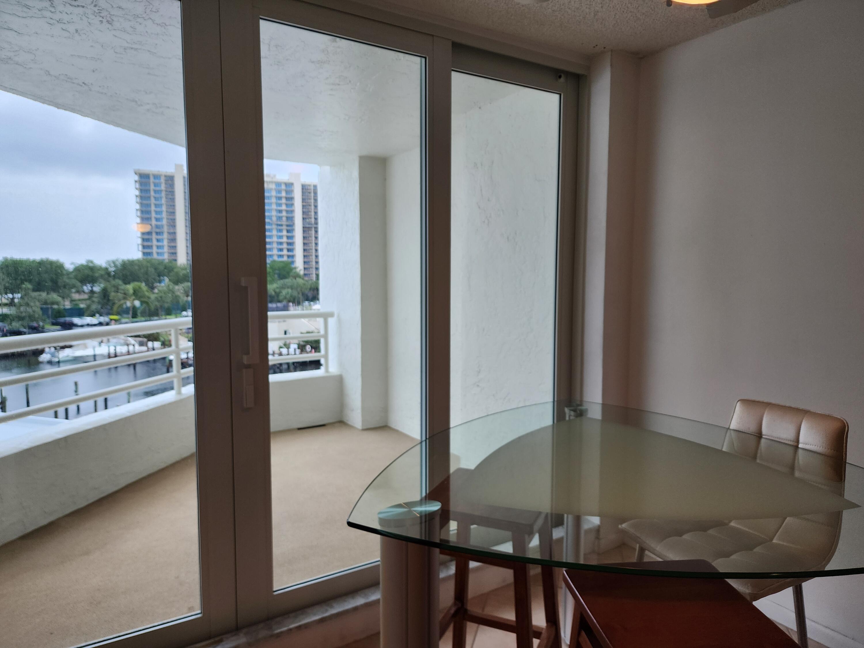 4201 North Ocean Boulevard, Unit 307 Boca Raton, FL 33431 - Photo 26 of 38 a view of a dining room with furniture and window
