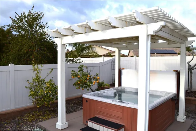 a view of a fountain with potted plants