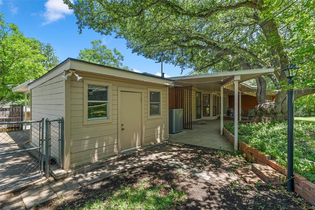 3924 North 30th Street Waco, TX 76708 - Photo 26 of 33 Attached workshop with benches, built-ins waiting for your tools or crafts.