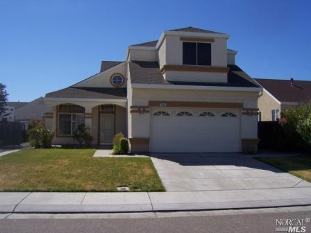 456 Wallace Street Rio Vista, CA 94571 - Photo 1 of 1 a front view of a house with a yard
