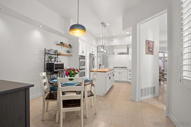a kitchen with a sink and stove