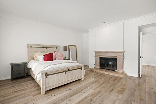 a bed room with a bed and a large window