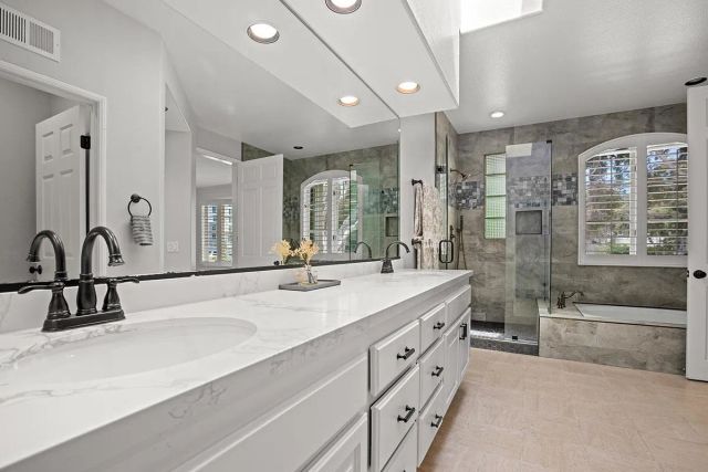 a bedroom with a bed and a fireplace