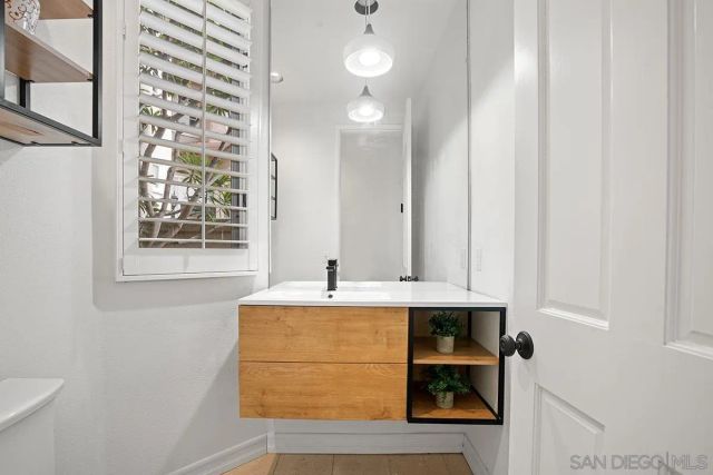 a bathroom with a sink toilet and tub