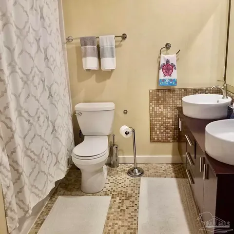 a bathroom with a toilet and a sink