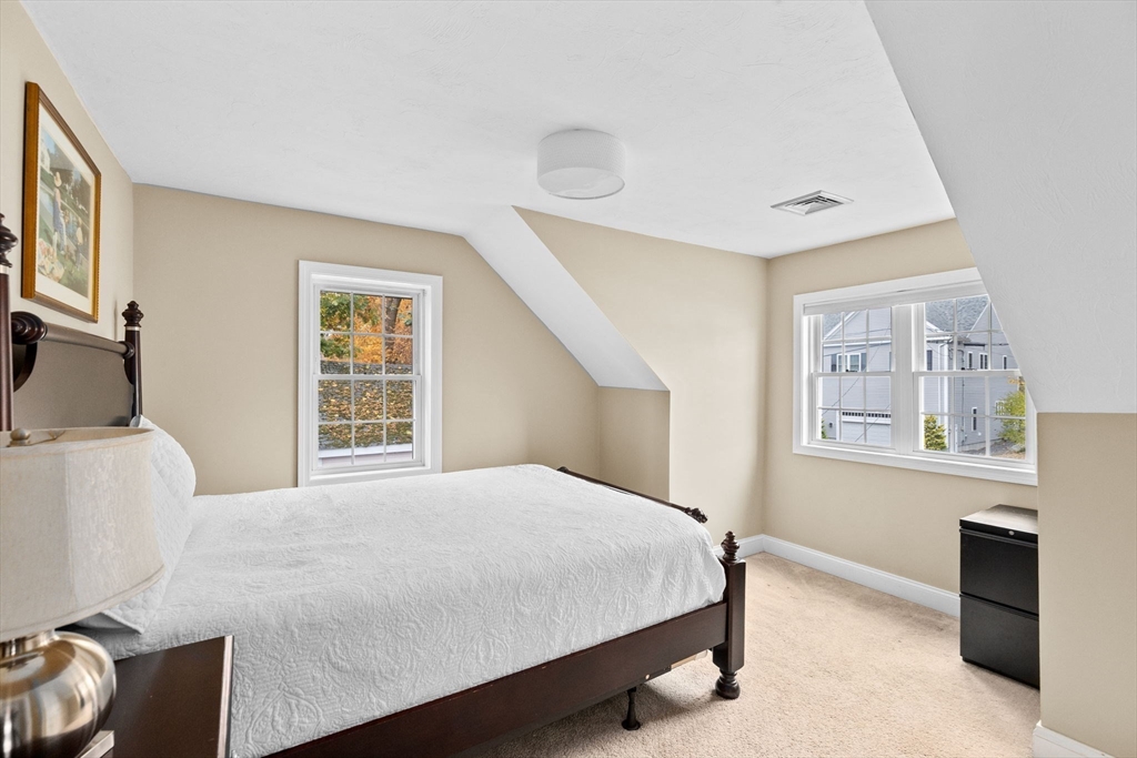 8 Hayes Road Hingham, MA 02043 - Photo 14 of 25 a bedroom with a bed and a window