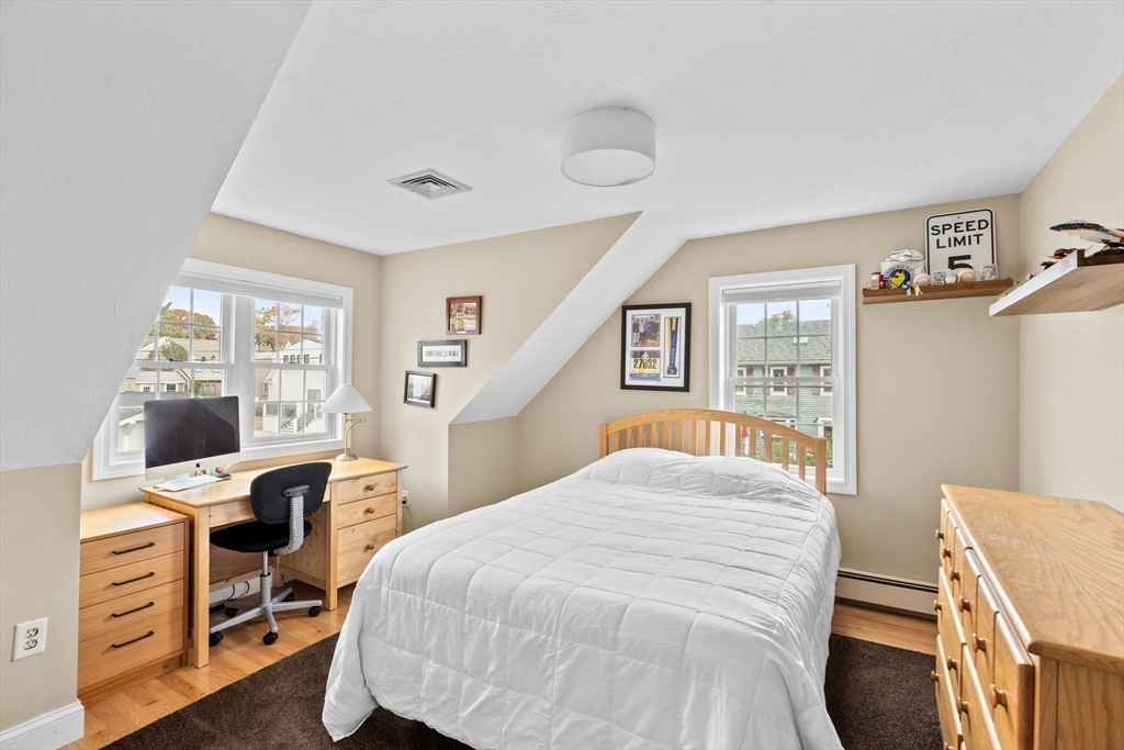 8 Hayes Road Hingham, MA 02043 - Photo 15 of 25 a bedroom with a bed and a desk in it