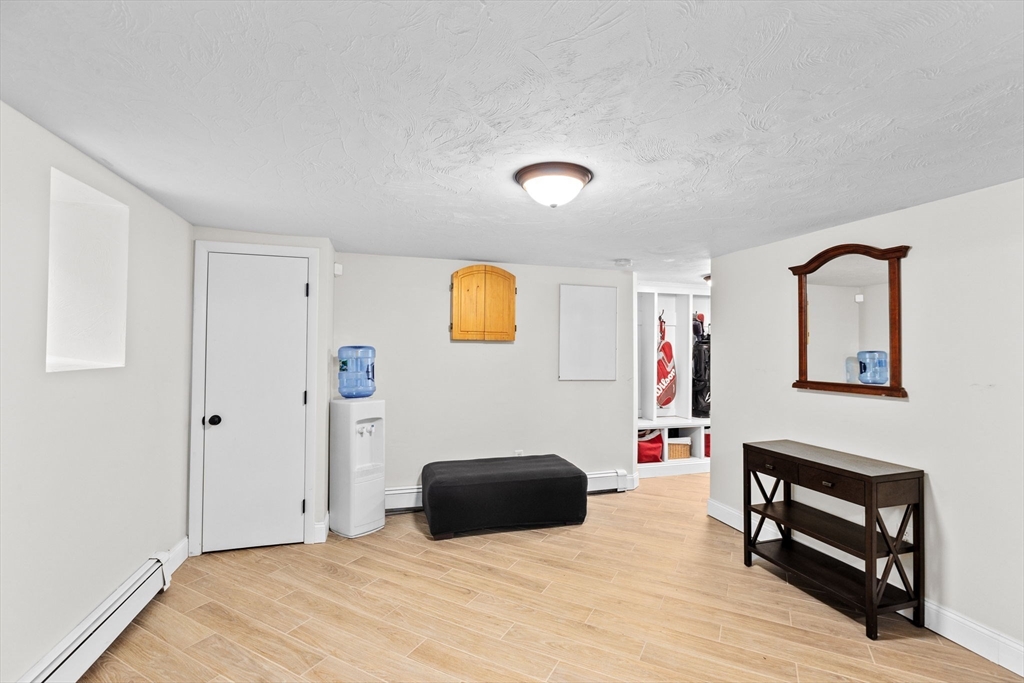 8 Hayes Road Hingham, MA 02043 - Photo 16 of 25 a bedroom with a bed and a dresser