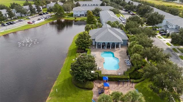 an aerial view of residential house with outdoor space and lake view