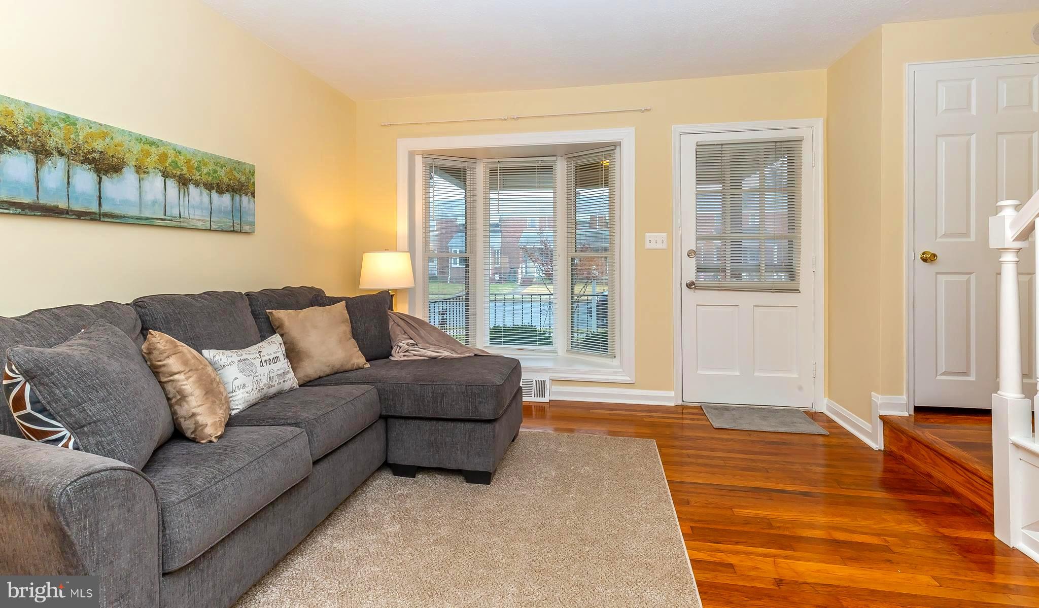 1957 Wareham Road Baltimore, MD 21222 - Photo 3 of 37 Living Room with Bay Window and Hardwoods