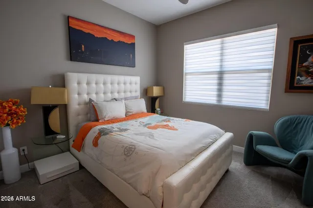 a bedroom with bed and a couch