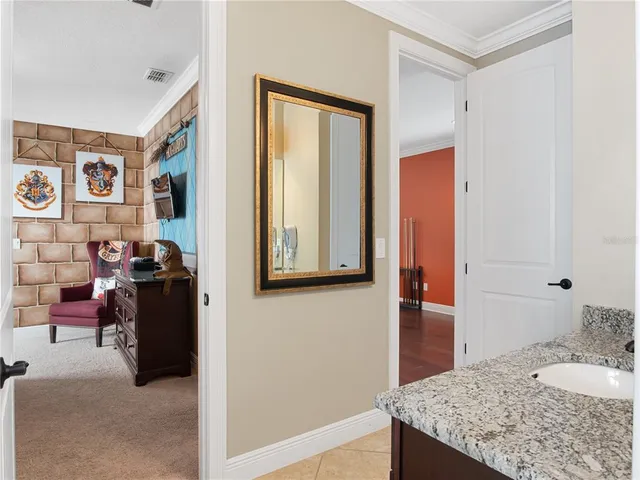 a dining area with furniture and a kitchen view
