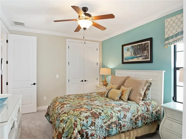 a view of a patio with couches table and chairs with potted plants