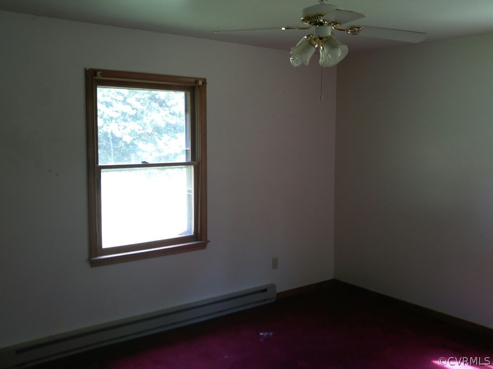 3558 Athey Road Sandy Hook, VA 23153 - Photo 7 of 10 an empty room with a window