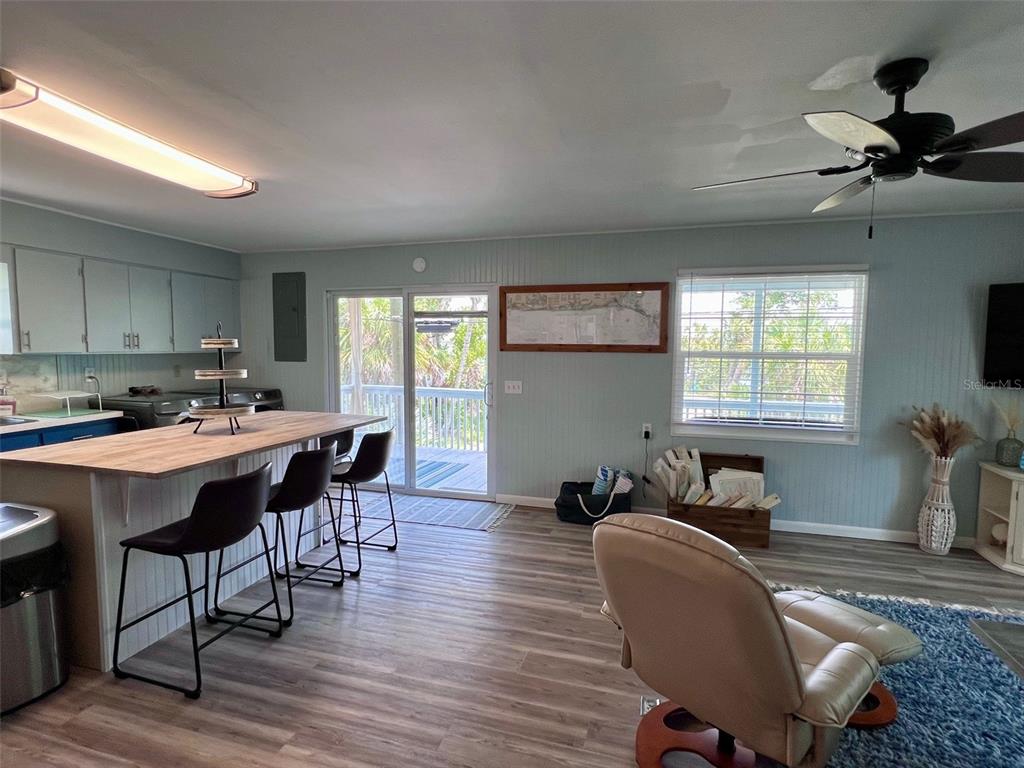 8142 Little Gasparilla Placida, FL 33946 - Photo 16 of 38 a view of a dining room with furniture window and wooden floor