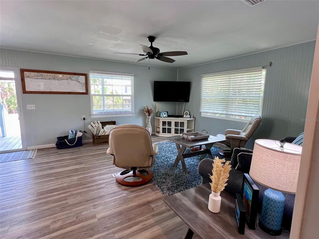 8142 Little Gasparilla Placida, FL 33946 - Photo 18 of 38 a living room with furniture a flat screen tv and a window