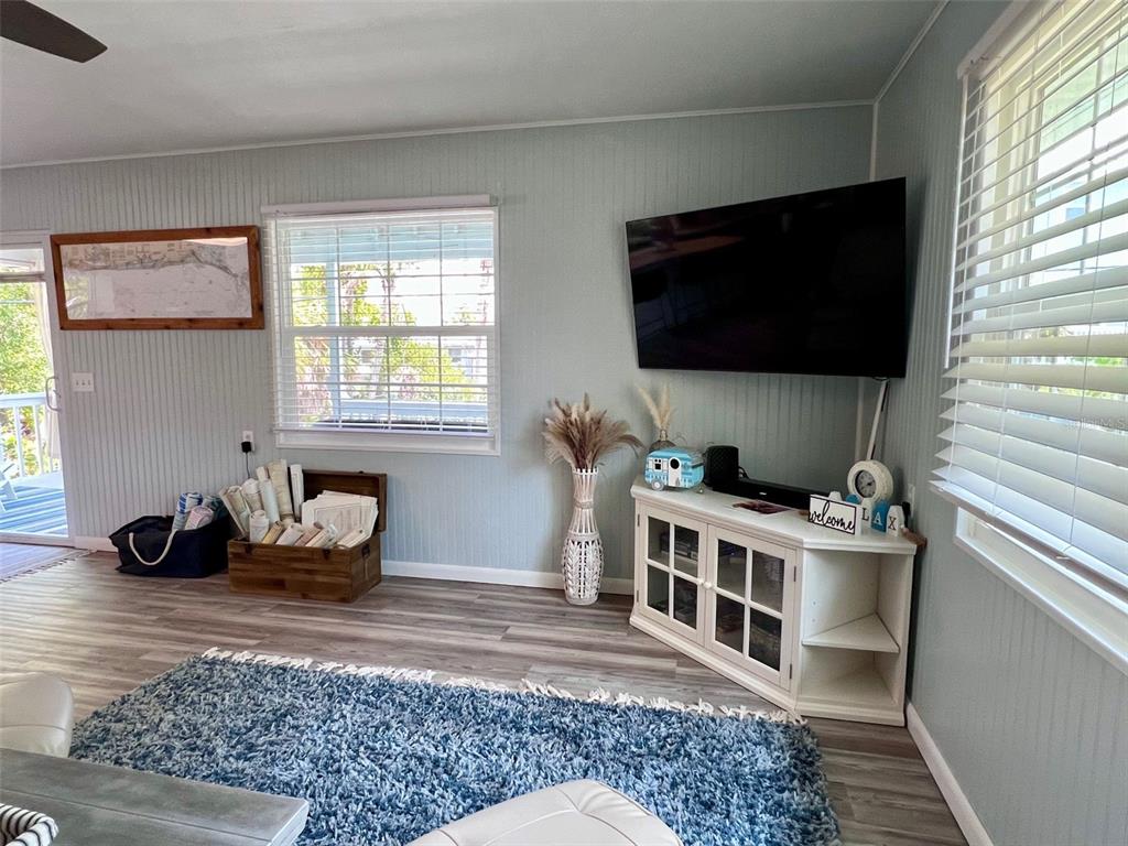 8142 Little Gasparilla Placida, FL 33946 - Photo 19 of 38 a living room with a couch and a flat screen tv