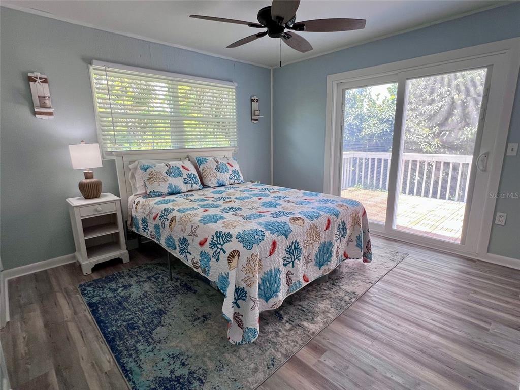8142 Little Gasparilla Placida, FL 33946 - Photo 20 of 38 a bedroom with a bed next to a window