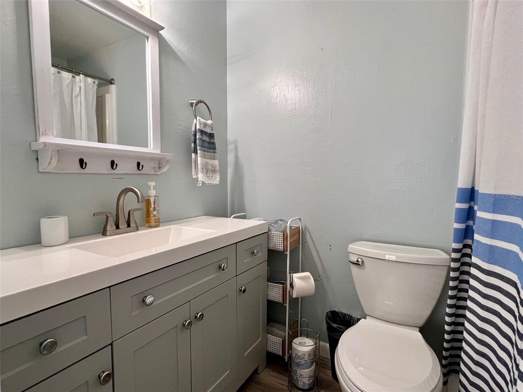 8142 Little Gasparilla Placida, FL 33946 - Photo 21 of 38 a bathroom with a toilet sink and mirror