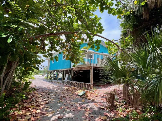 a view of a chair and table under an umbrella