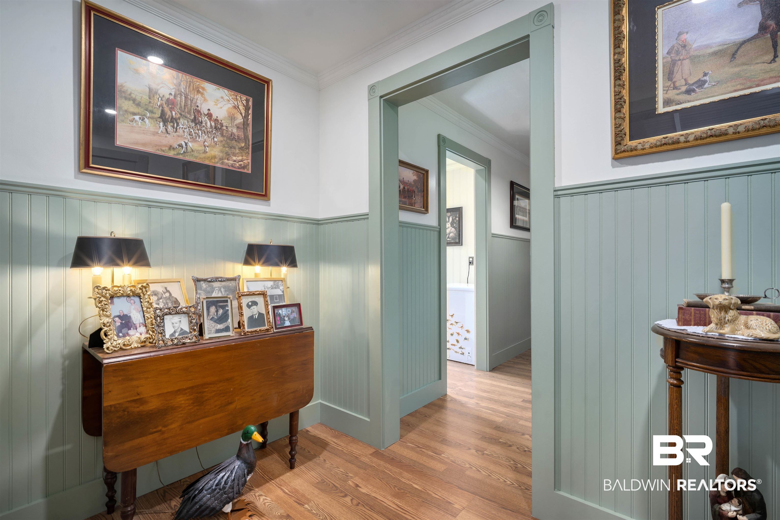 22 Horace Odom Road Millry, AL 36558 - Photo 28 of 39 Hall featuring light wood finished floors, ornamental molding, and wainscoting