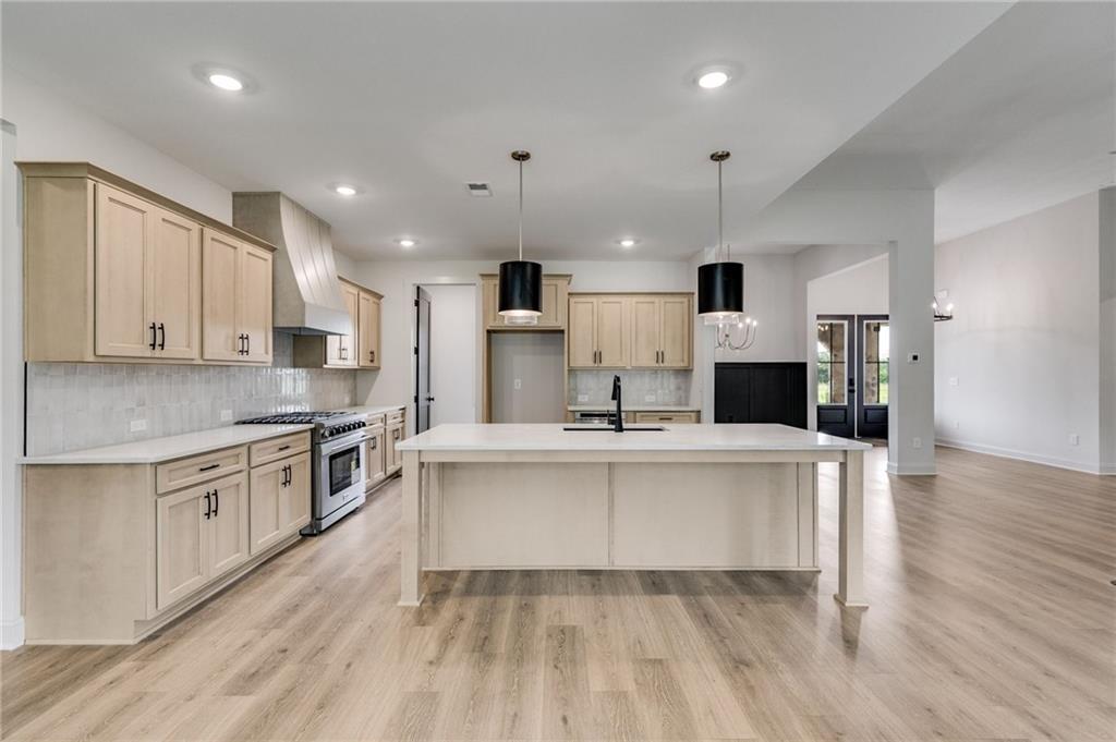 728 Lake Cir Road Buchanan, GA 30113 - Photo 15 of 50 a kitchen with stainless steel appliances a sink a stove a refrigerator and cabinets