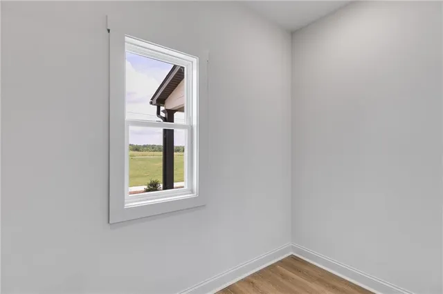 a view of a livingroom with a ceiling fan and window