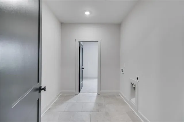 an empty room with furniture and a window