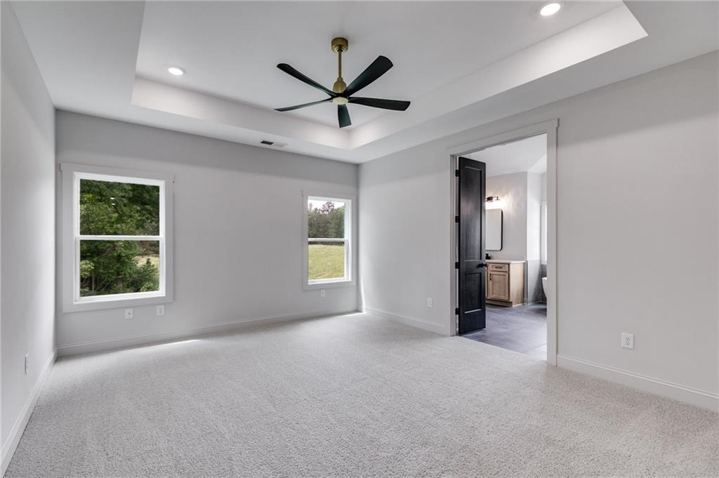 728 Lake Cir Road Buchanan, GA 30113 - Photo 22 of 50 a view of a livingroom with a ceiling fan and window