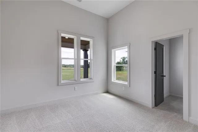 a bathroom with a granite countertop sink double and mirror