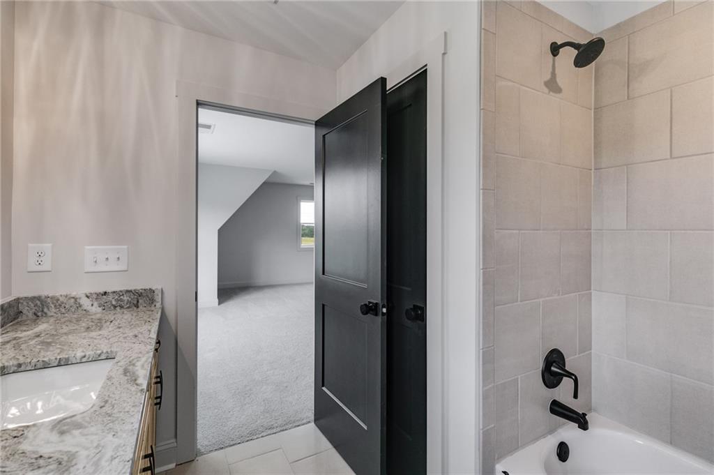 728 Lake Cir Road Buchanan, GA 30113 - Photo 38 of 50 a bathroom with a granite countertop sink and shower