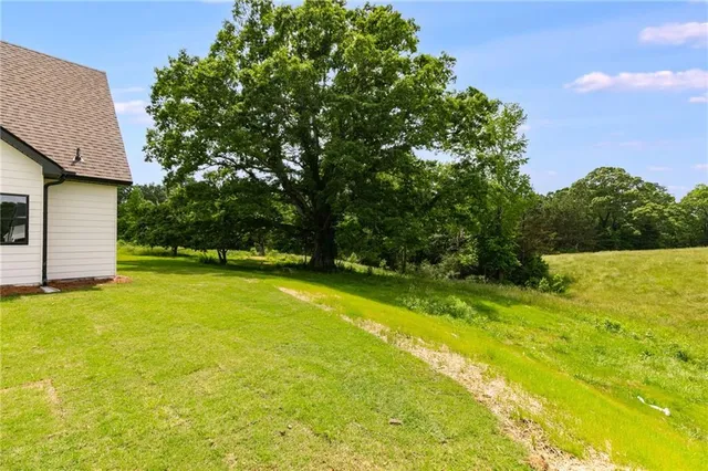 an aerial view of a house with a swimming pool