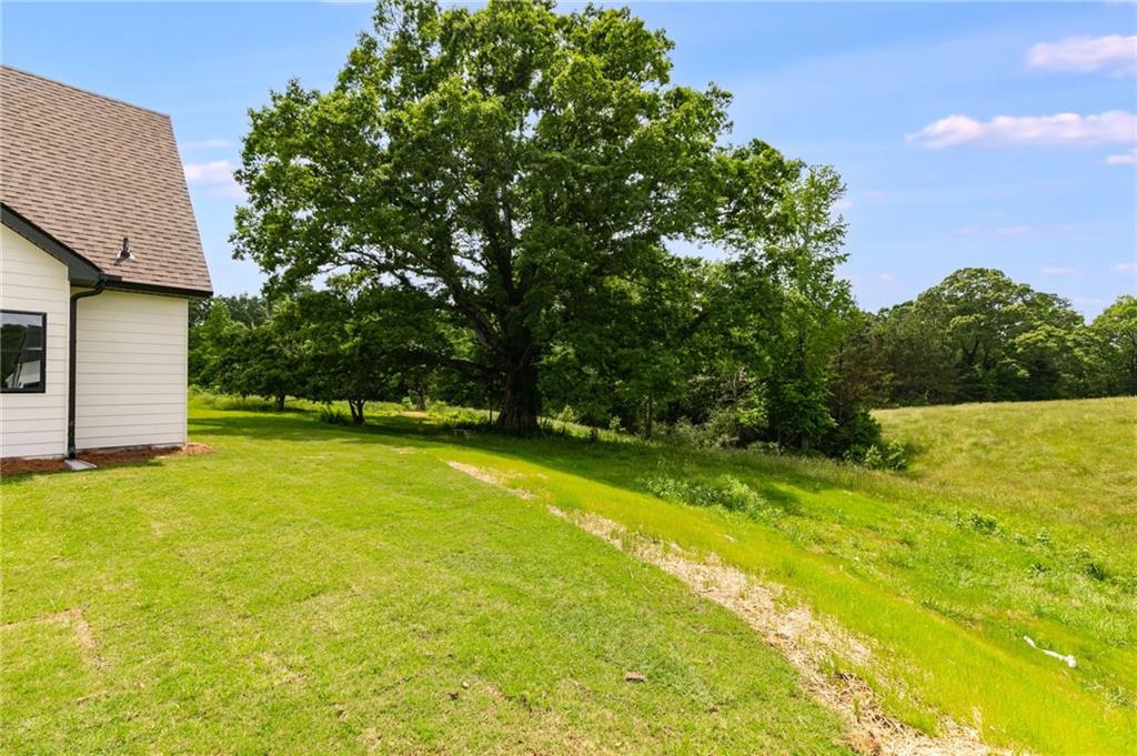 728 Lake Cir Road Buchanan, GA 30113 - Photo 40 of 50 a view of a swimming pool with an outdoor space and seating area
