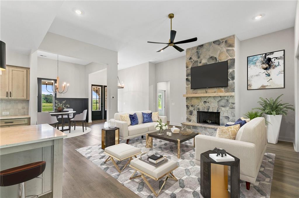 728 Lake Cir Road Buchanan, GA 30113 - Photo 46 of 50 a living room with furniture a fireplace and a flat screen tv