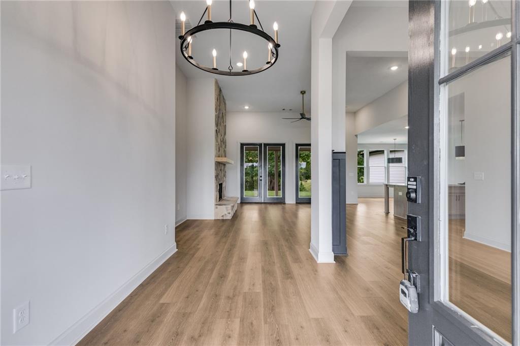 728 Lake Cir Road Buchanan, GA 30113 - Photo 6 of 50 wooden floor in an empty room and a window