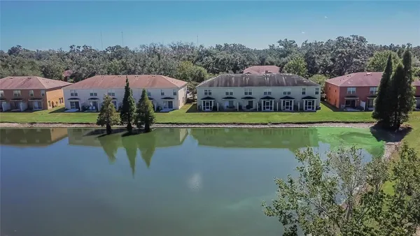 an aerial view of a house with swimming pool