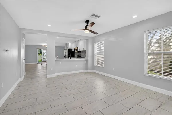 a view of a kitchen and a window in a room