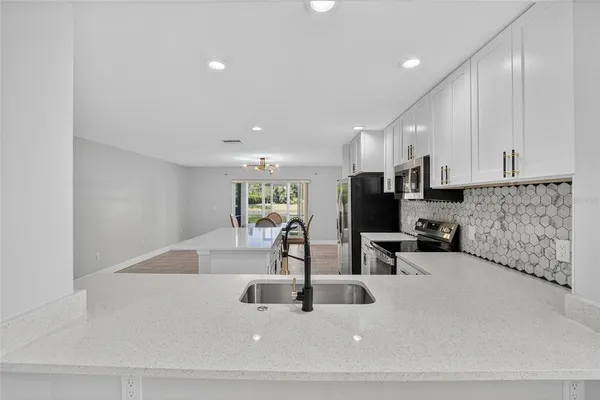 a view of a kitchen with dining area