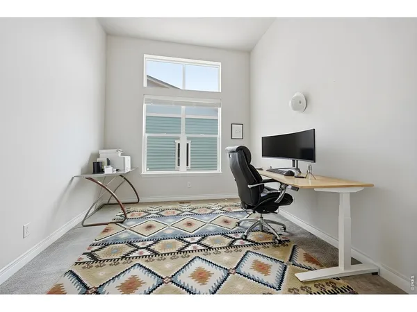 a workspace with furniture and a window
