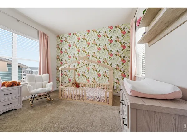 a living room with a couch and a window