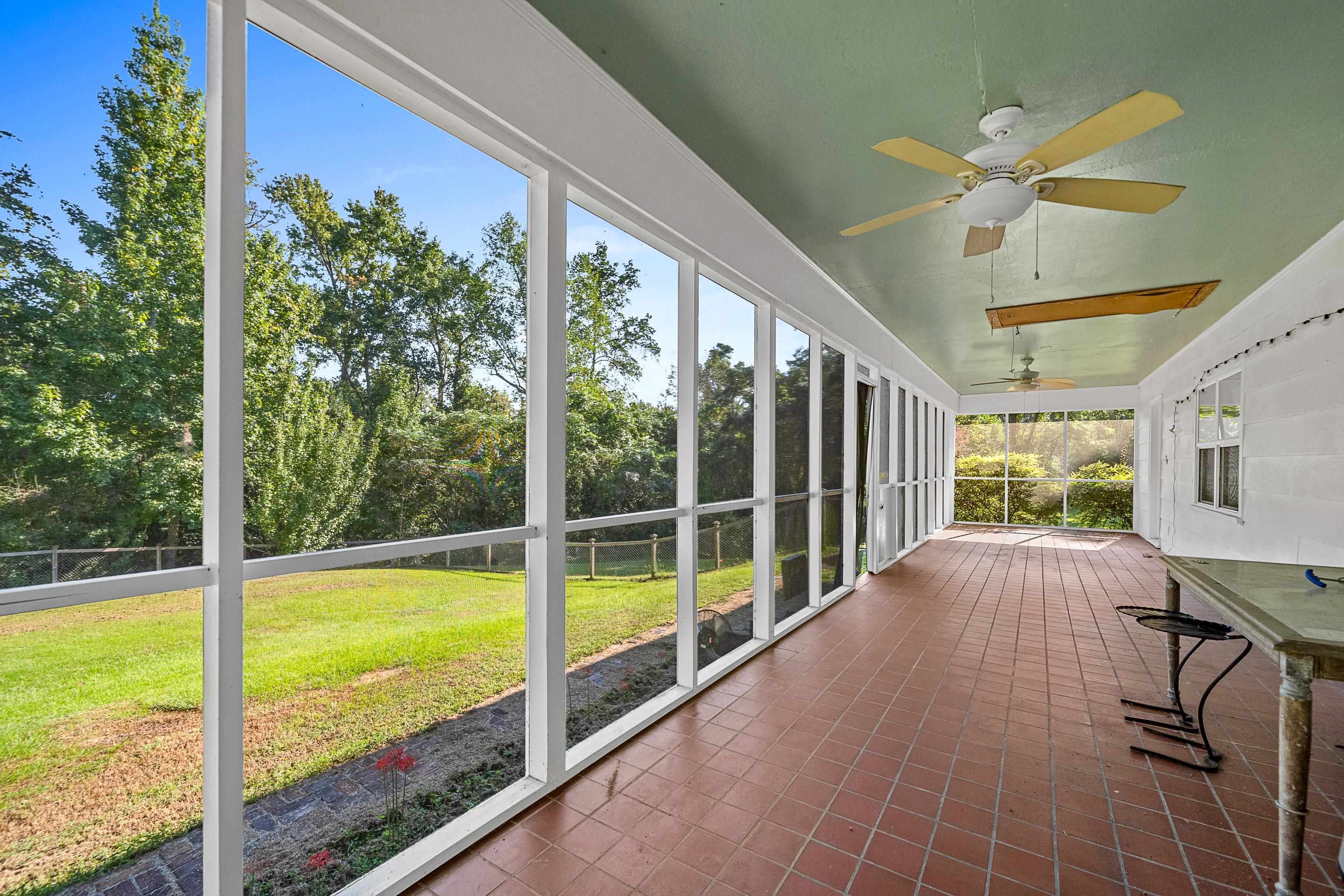 9350 Tompkins Road Stockton, AL 36579 - Photo 27 of 36 Unfurnished sunroom featuring a ceiling fan