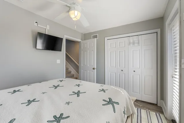 a bedroom with a bed and a window