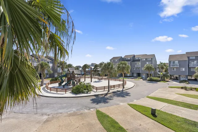 a view of a balcony with wooden fence