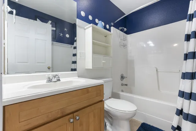 a view of a house with a small yard