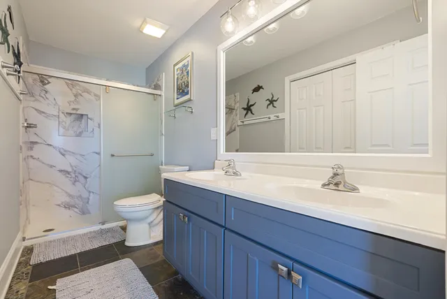 an aerial view of residential building and ocean