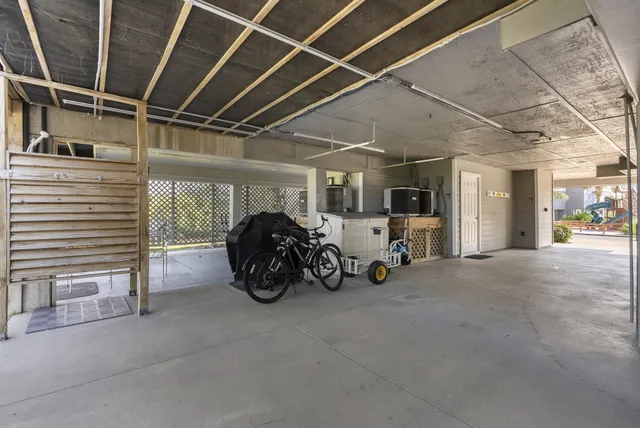 a bedroom with furniture and a flat screen tv