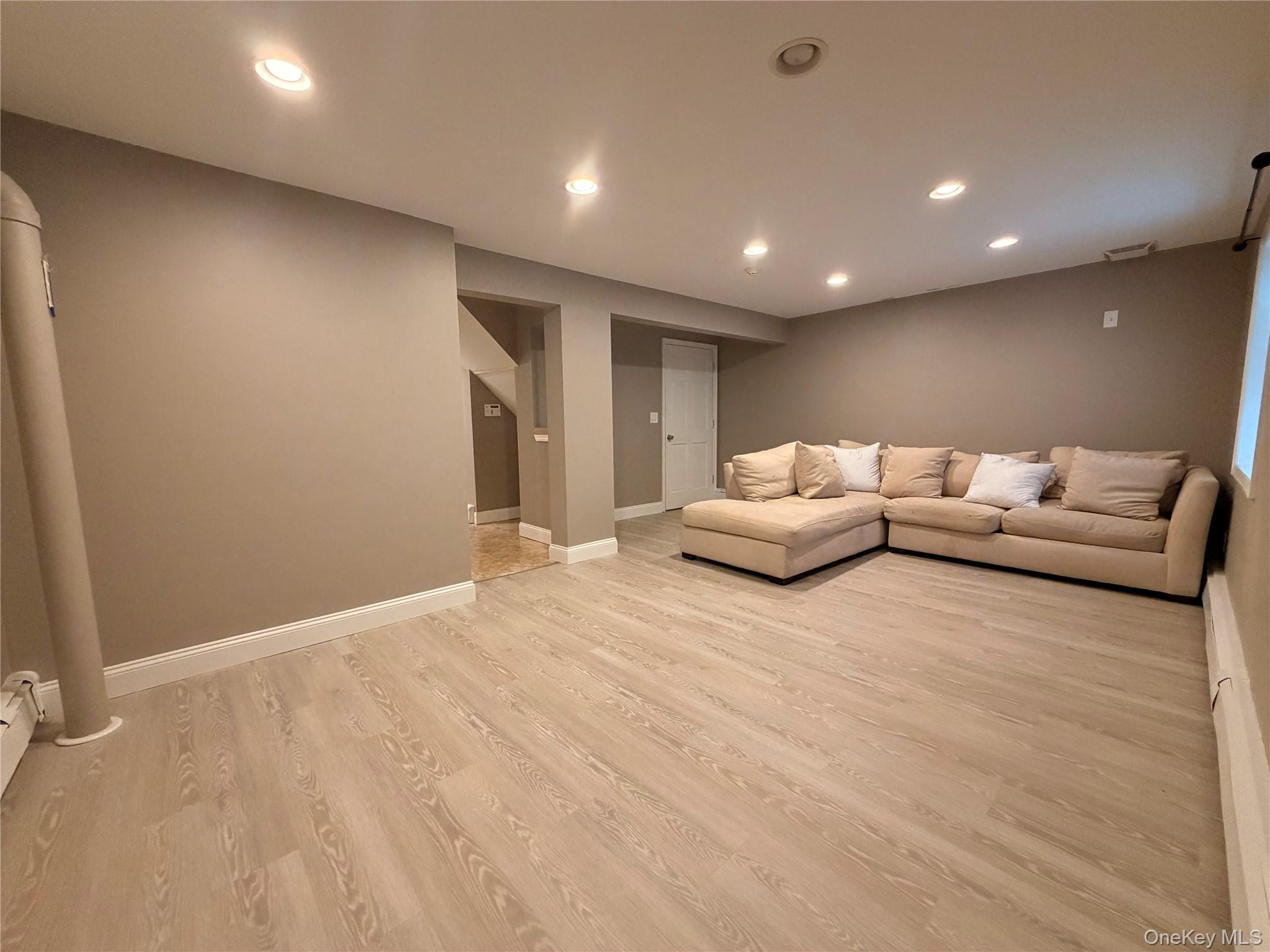 157 Brewer Road, Unit 1A Newburgh, NY 12550 - Photo 7 of 8 Spacious room featuring light wood-finish flooring, recessed lighting, and neutral wall paint